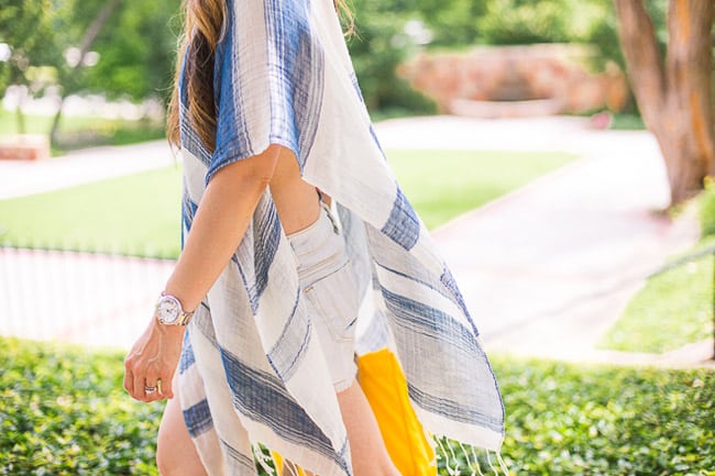 chic at every age, beach swimsuit coverup, how to wear a poncho, TOMS yellow backpack, urban outfitters striped open poncho