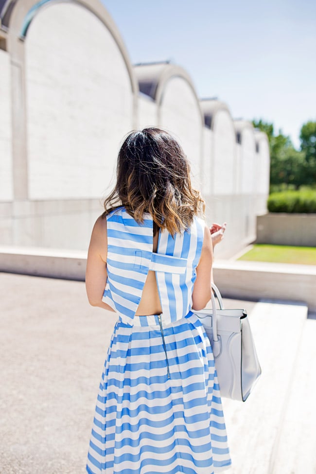 blue striped crop top and midi skirt matched set coordinates, yellow tassel earrings, retro modern style, how to wear a midi skirt, lob haircut with ombre highlights