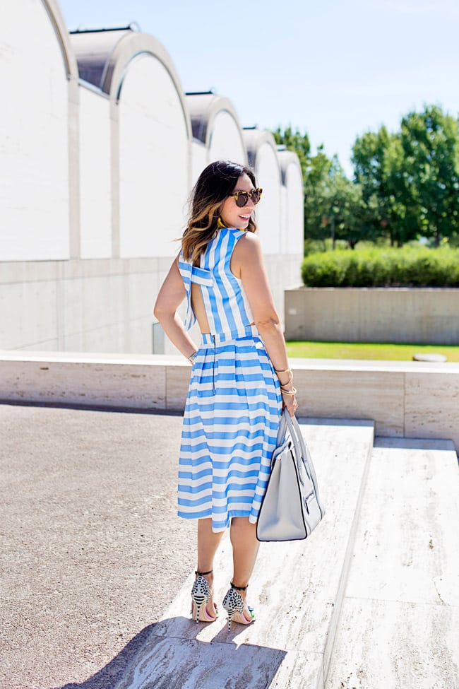 blue striped crop top and midi skirt matched set coordinates, yellow tassel earrings, sophia webster lilico floral heels, retro modern style, how to wear a midi skirt, white celine luggage tote