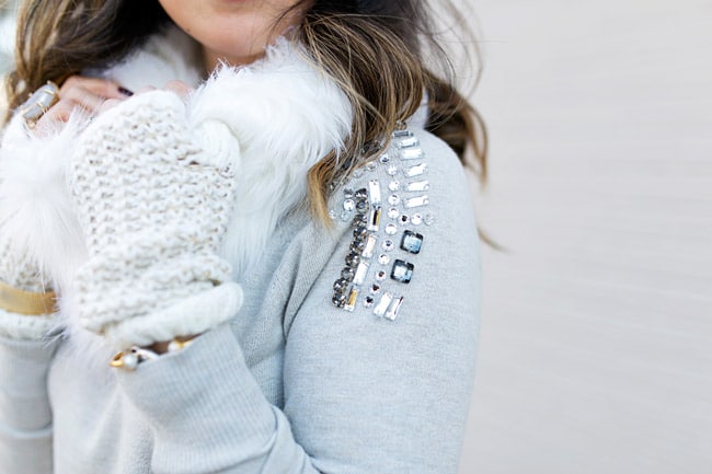 winter neutral outfit, how to wear a faux fur scarf, fingerless gloves, target embellished sweater