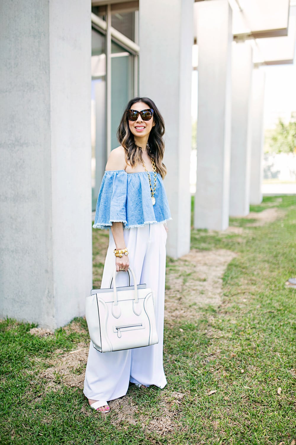off the shoulder denim top, alice and olivia wide leg pants, celine luggage tote, julie vos mother of pearl pendant, baroque cuff, siena bangle, how to wear a crop top without showing your midriff