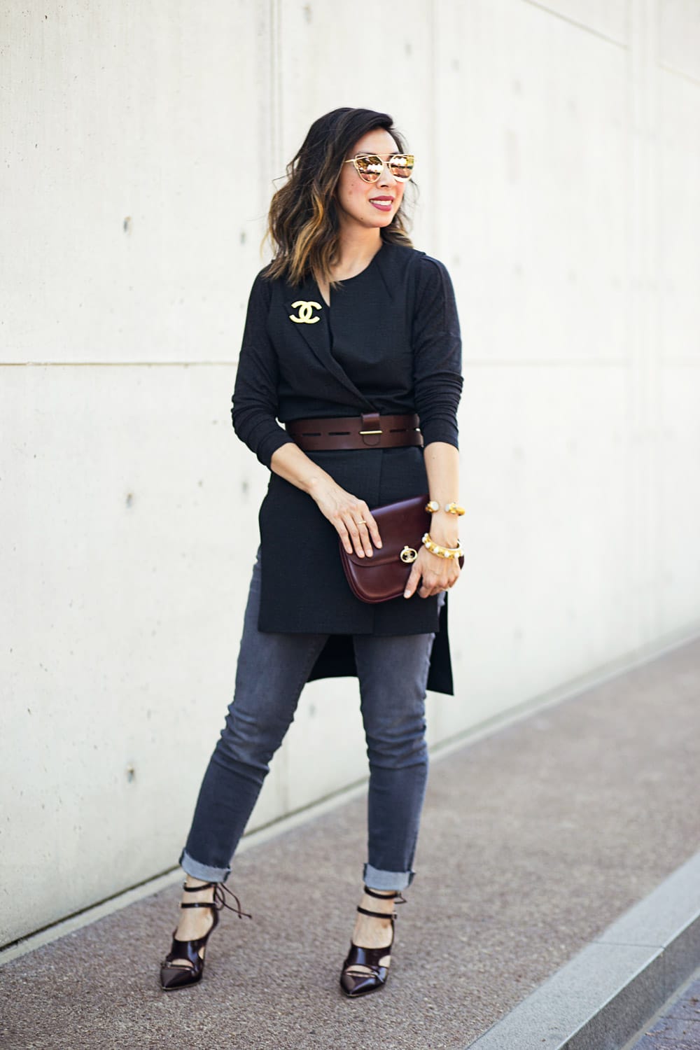 cabi drafting vest with chanel brooch and slim boyfriend jeans for a girls night out outfit