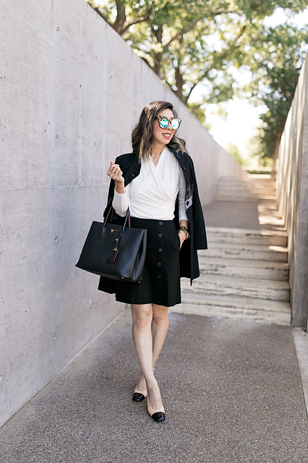 cabi wrap tee and utility skirt with chanel slingbacks for a black and white work outfit