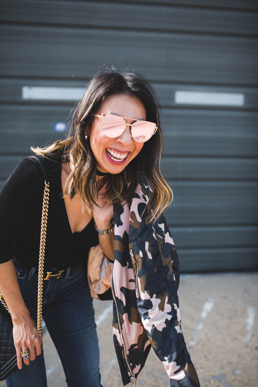 T+J rose gold sunglasses and happy girl blogger laughing