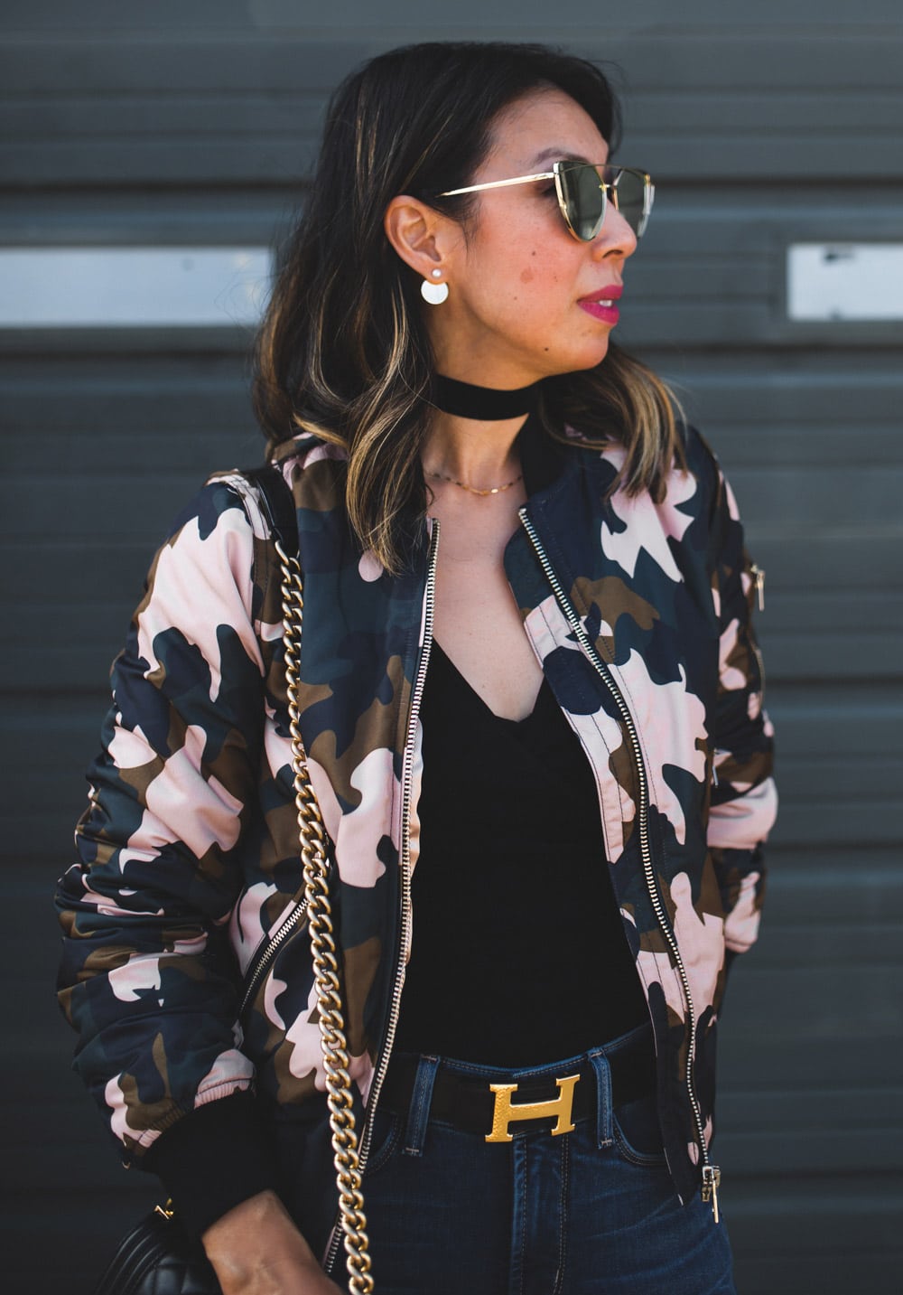 topshop camo bomber jacket with black body suit, choker and chanel boy bag