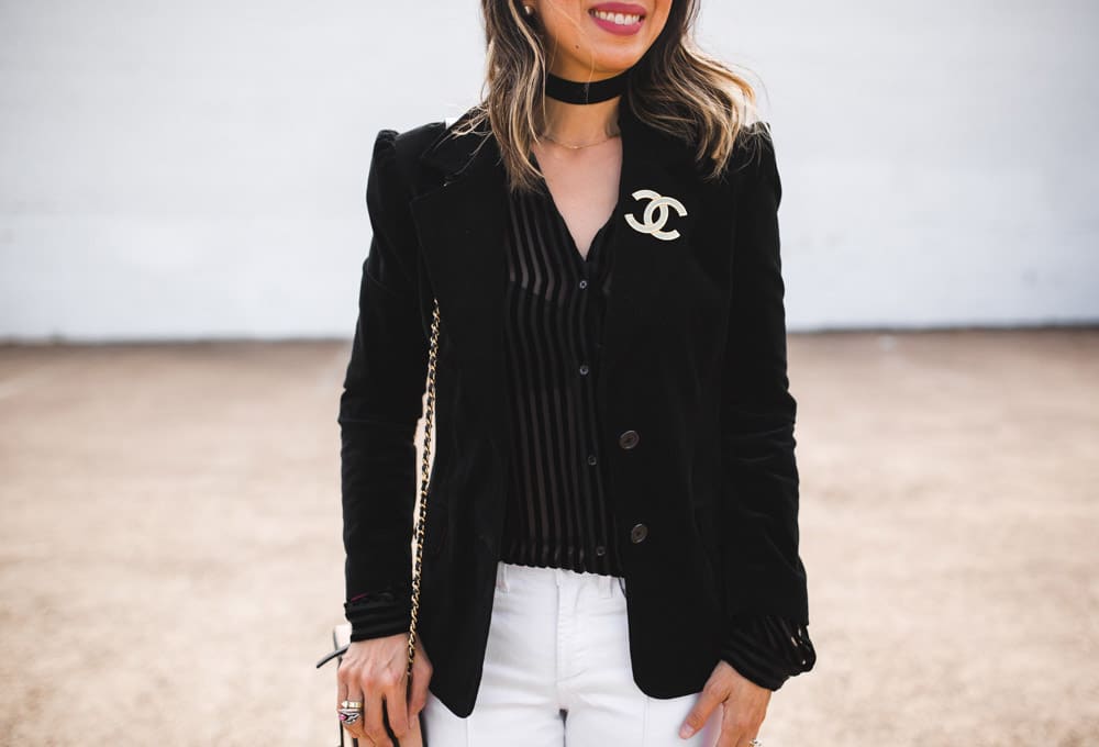 paige linara velvet top with black velvet blazer and white flare jeans, chanel brooch, forty something fashion