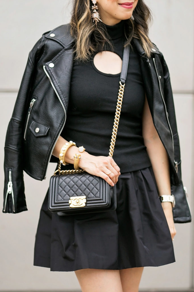 black beaufille keyhole turtleneck, miu miu faille skirt, moto jacket, chanel boy bag