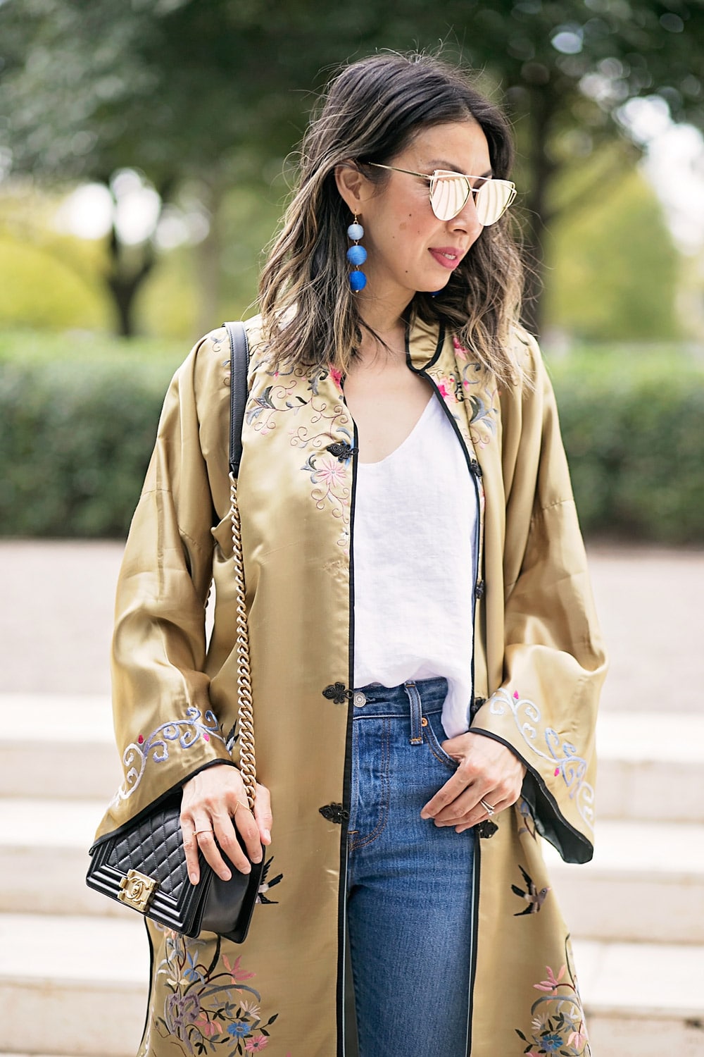 gold embroidered asian robe with white tank and levi's mom jeans