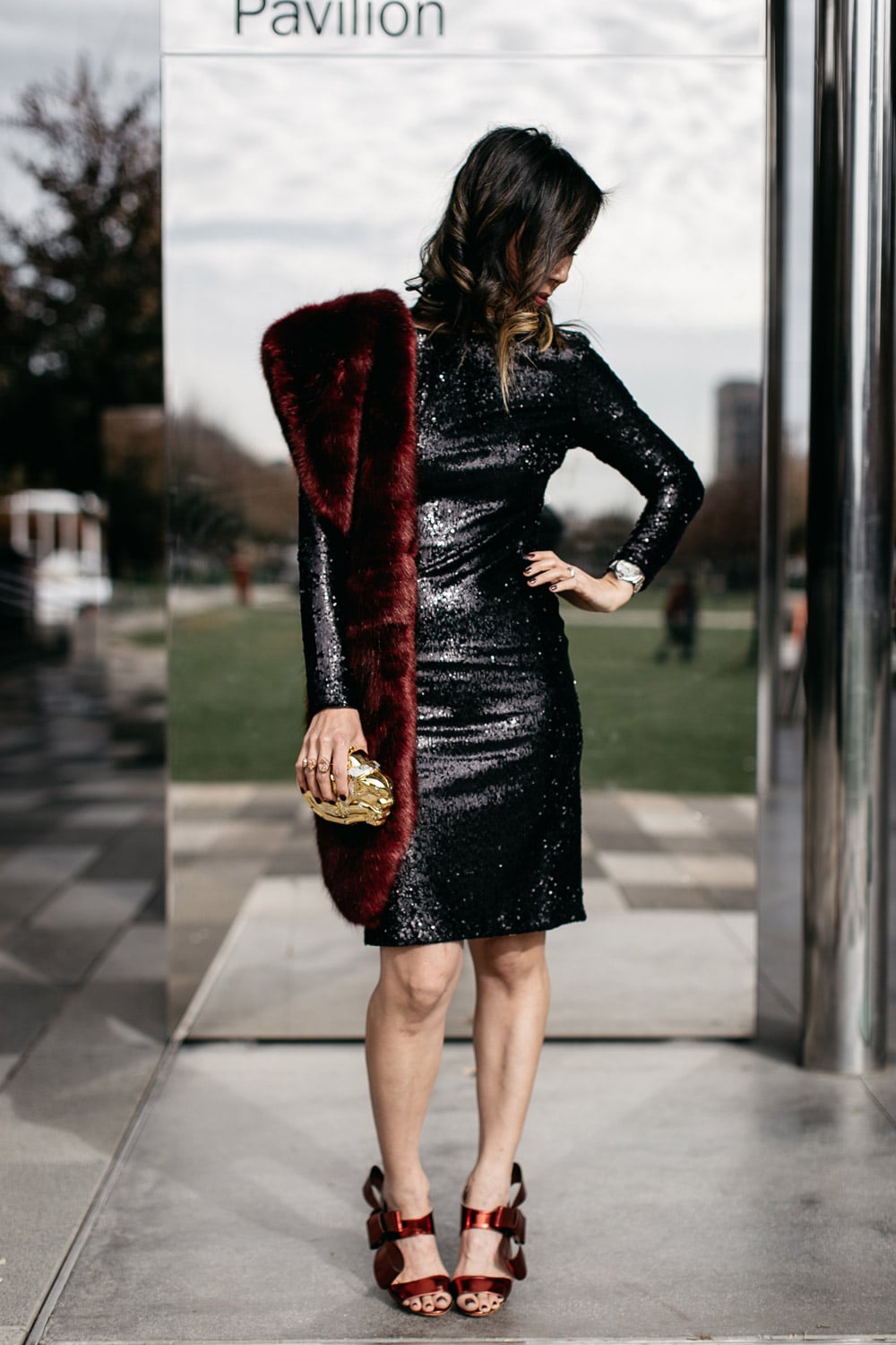 black sequin dress with burgundy fur stole and delpozo bow sandals