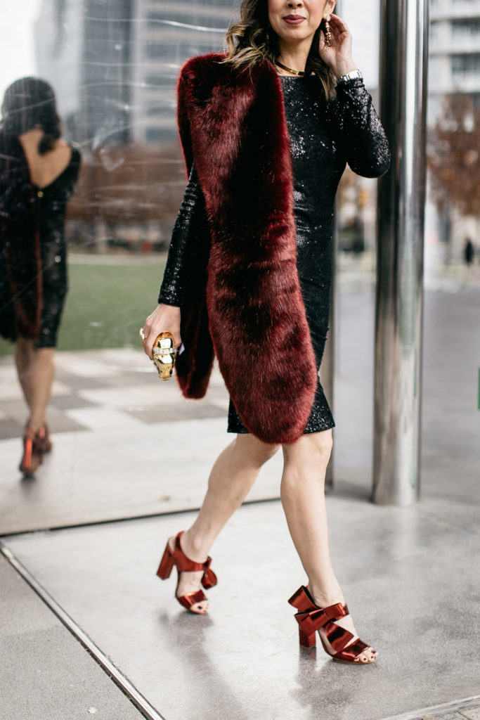 black sequin dress with burgundy fur stole and delpozo bow sandals