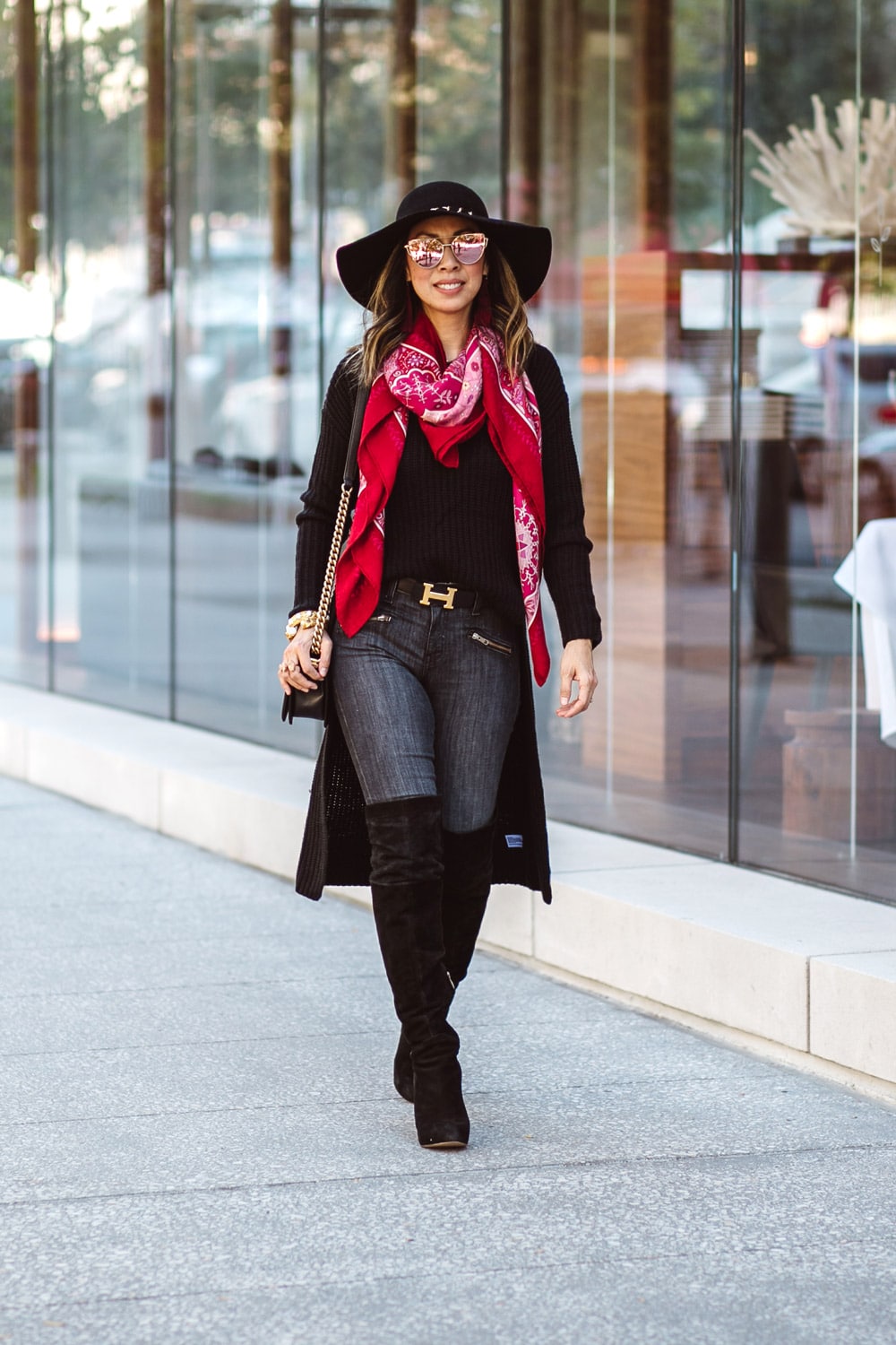 black high low sweater with sam edelman otk boots, wide brim hat, pink and red hermes shawl