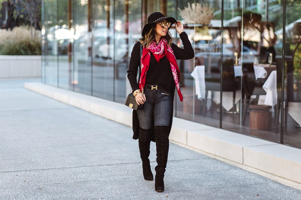 black high low sweater with sam edelman otk boots, wide brim hat, pink and red hermes shawl