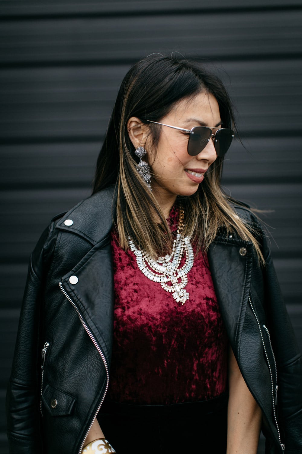 easy holiday outfit, burgundy velvet bodysuit and moto jacket, T+J design statement necklace, sachin and babi grape earrings