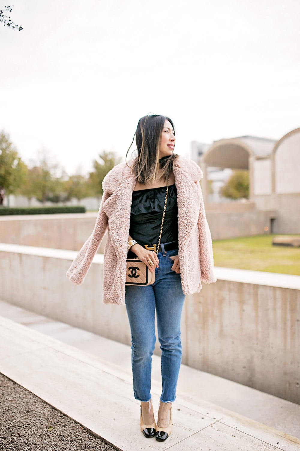 tularosa pink fur coat, velvet off the shoulder top with high waisted jeans and chanel slingbacks