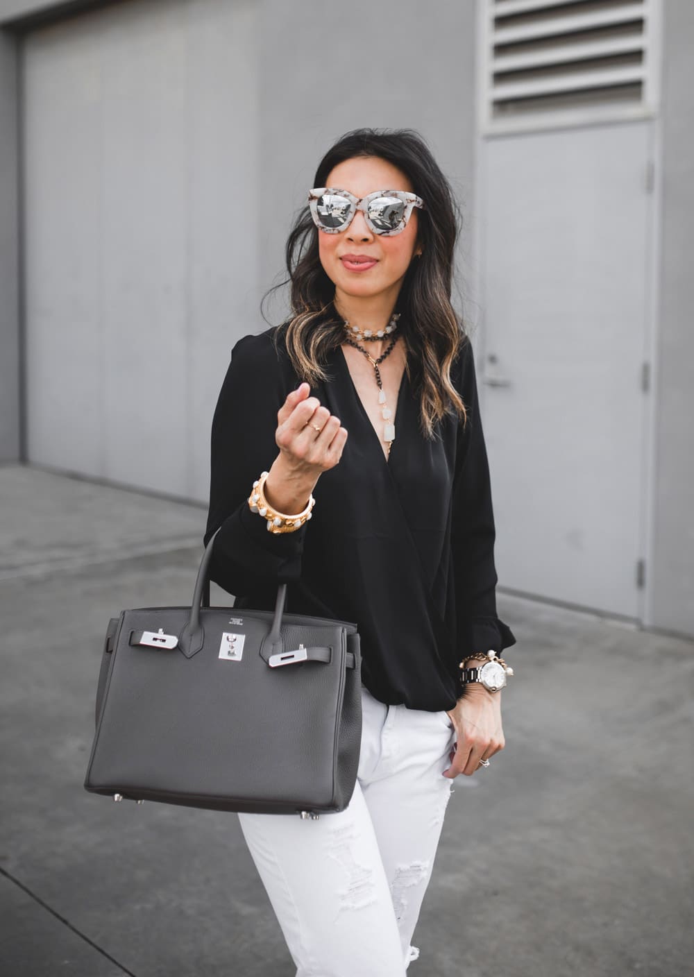trouve black cutout top with white distressed jeans with hermes birkin 30 in etaine