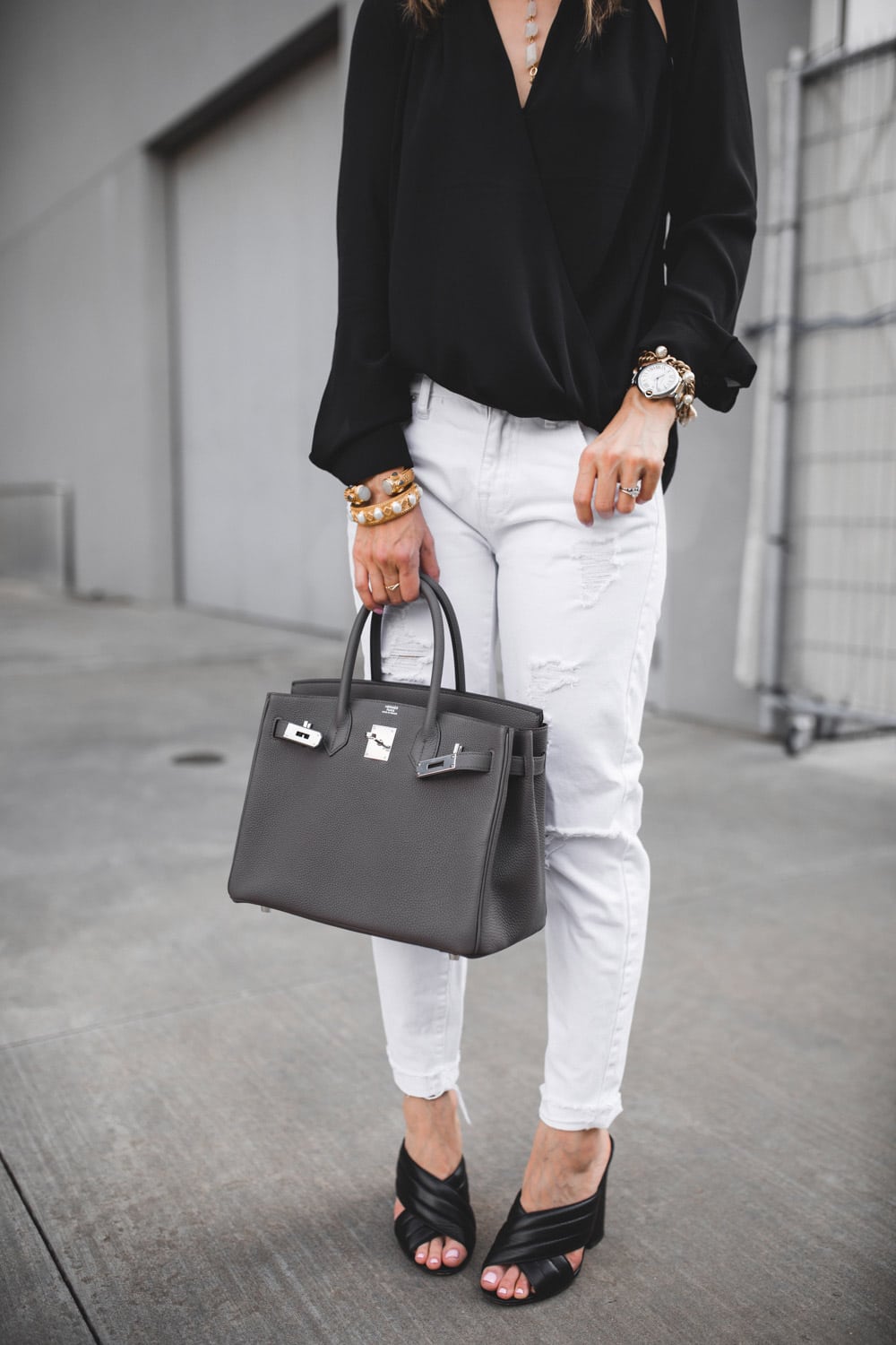 trouve black cutout top with white distressed jeans and black gucci webby sandals with hermes birkin 30 in etaine
