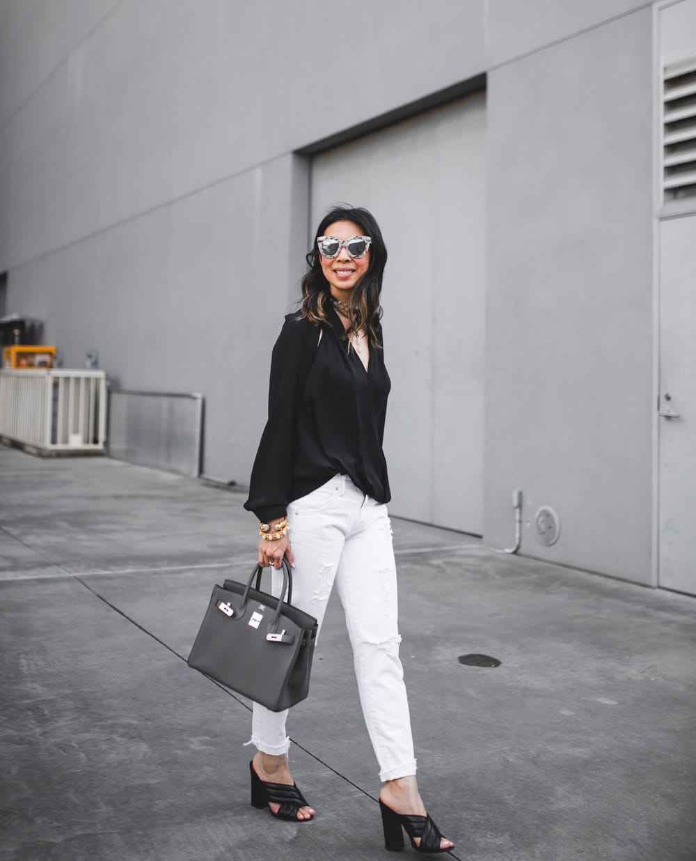 trouve black cutout top with white distressed jeans and black gucci webby sandals with hermes birkin 30 in etaine