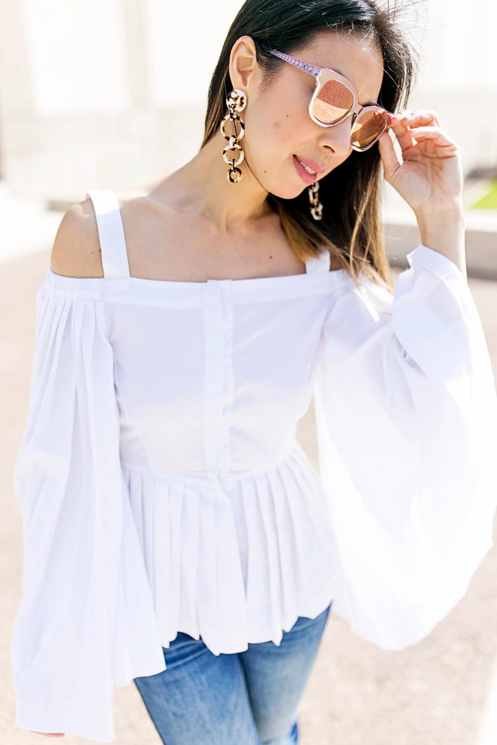 charles youssef pleated off the shoulder top with lele sadoughi windchime earrings and whbm tuxedo jeans