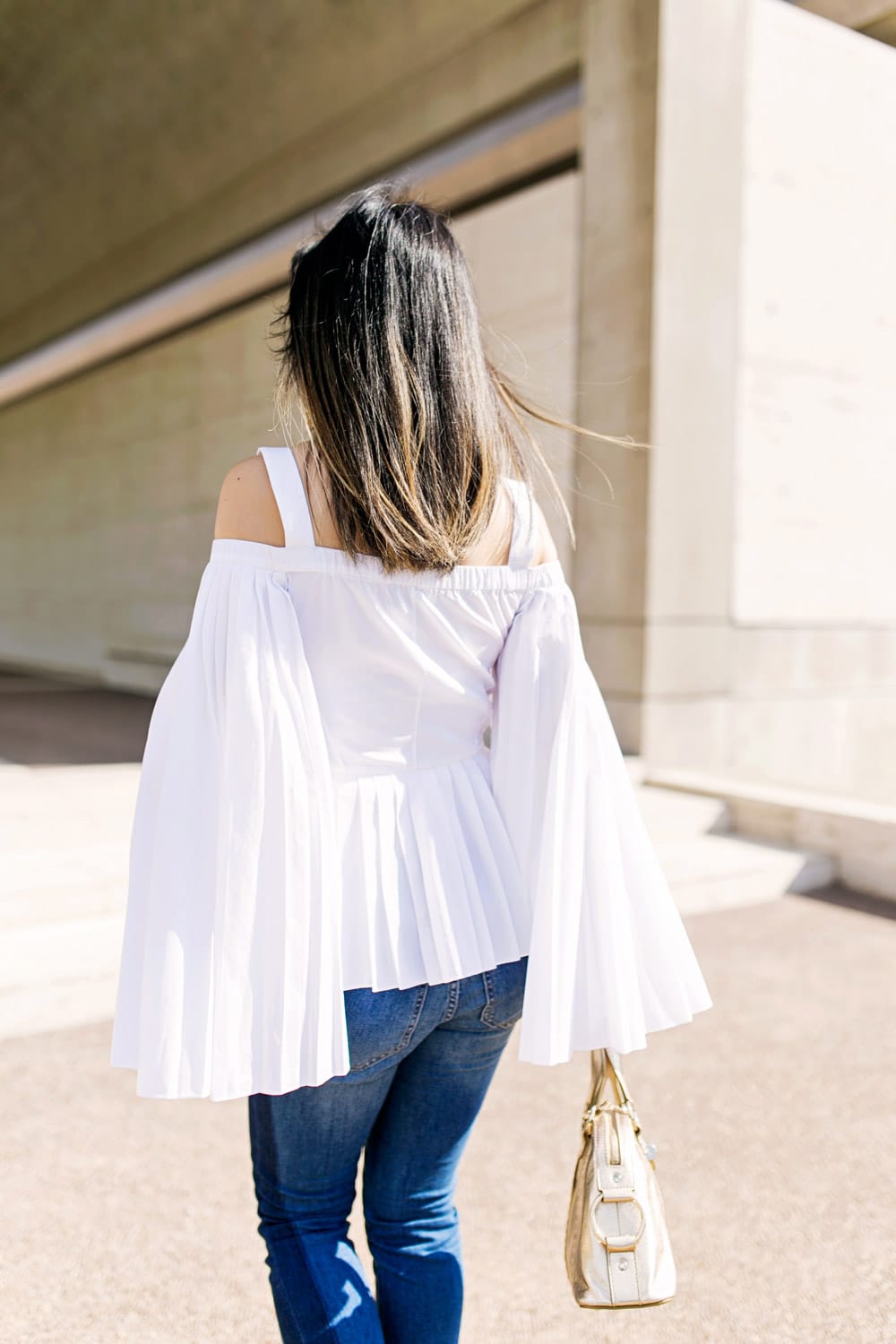 charles youssef pleated off the shoulder top with lele sadoughi windchime earrings and whbm tuxedo jeans