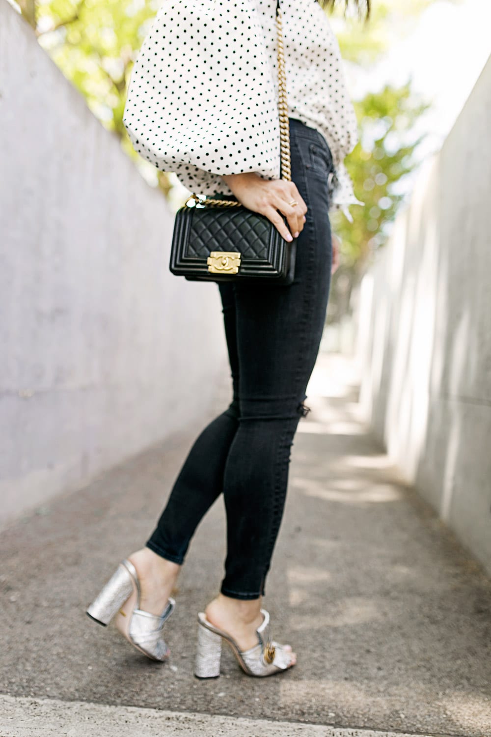 polka dot puff sleeve off the shoulder top with lele sadoughi plumeria drop earrings, rag and bone slit capri jeans in steel, gucci silver marmont mules 