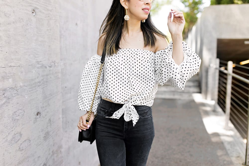 polka dot puff sleeve off the shoulder top with lele sadoughi plumeria drop earrings, rag and bone slit capri jeans in steel, gucci silver marmont mules 