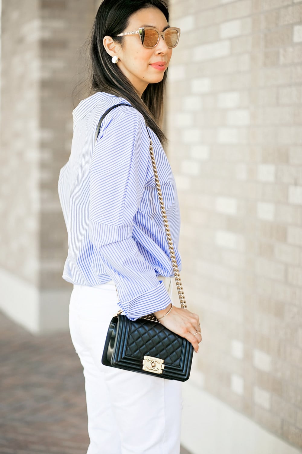 who what wear one shoulder button top with white boyfriend jeans and chanel boy bag