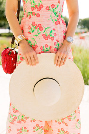 pink floral tiered maxi dress strawberry wicker bag cuyana oversized beach hat