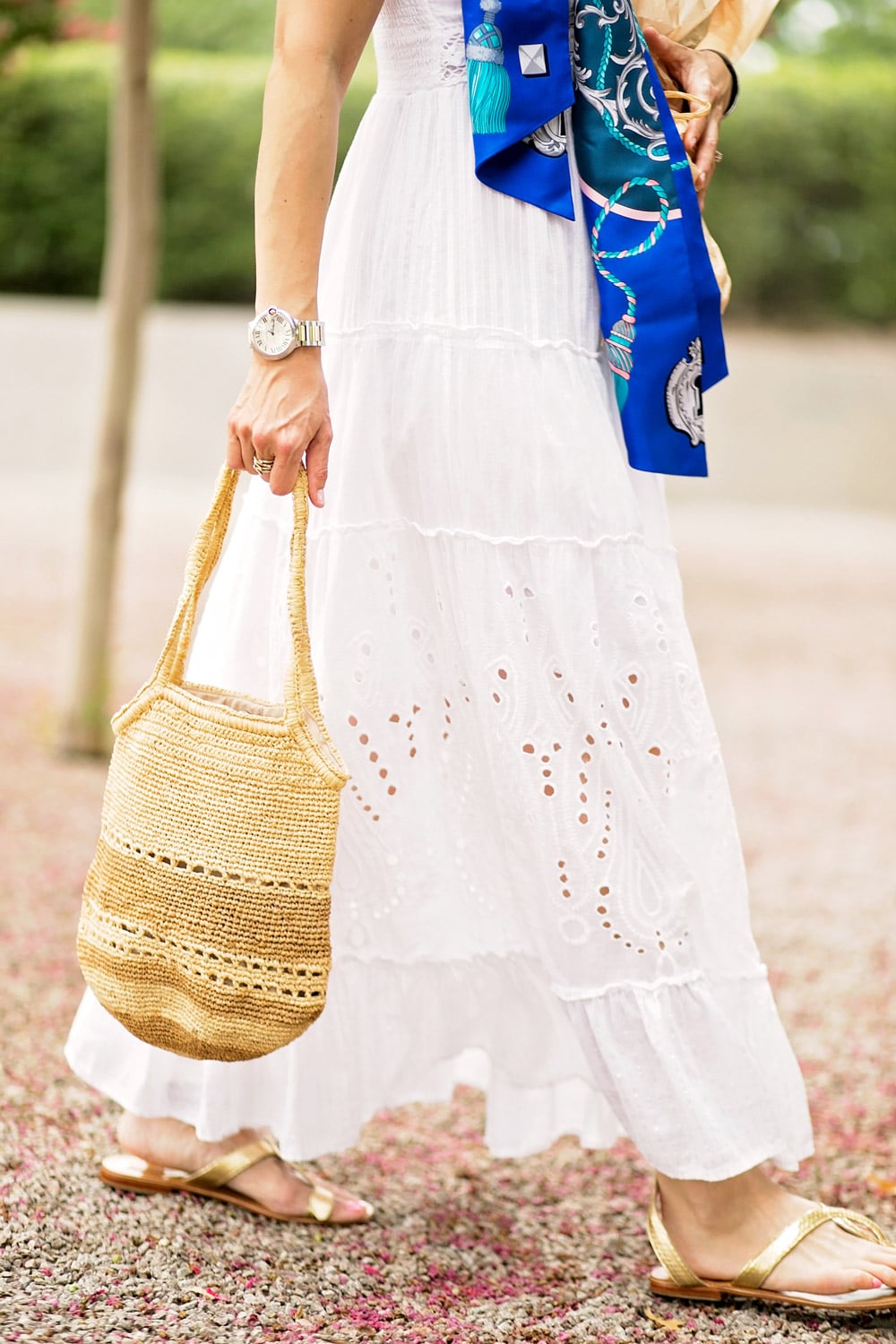 white eyelet maxi dress cocobelle l*space snake wrap sandals straw bag santorini inspired vacation outfit