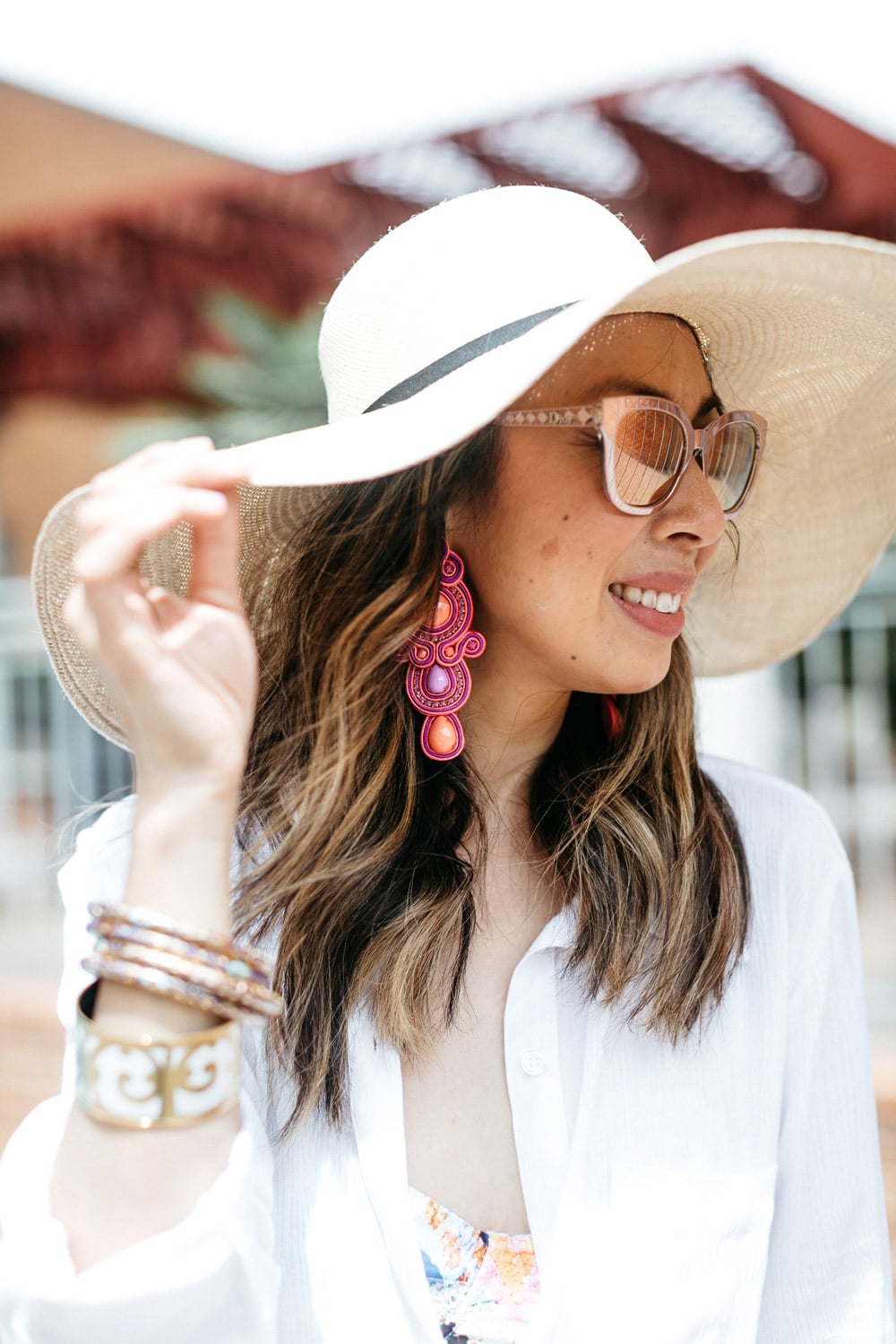 cuyana oversized beach hat alejandra aspillaga statement earrings dior diorama caged sunglasses