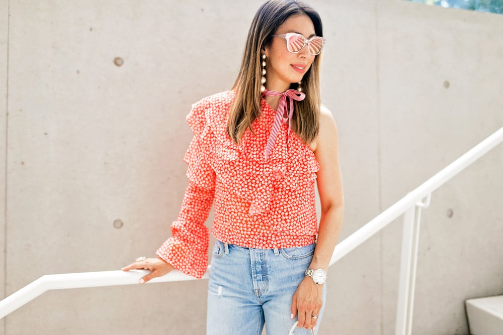 rosie assoulin corkscrew one shoulder ruffle top dupe levi's wedgie jeans pearl drop earrings dior diorama cage sunglasses