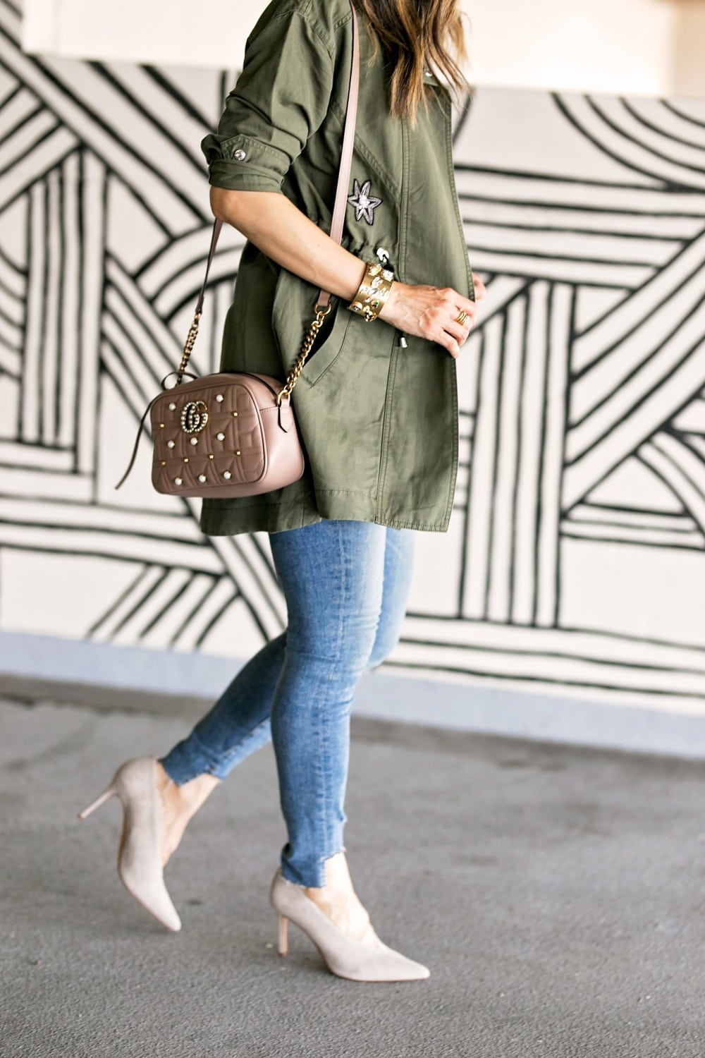 cabi hanson anorak embellished army green jacket white tee good american high waist skinny jeans vince camuto ankia pump gucci marmont pearl camera bag