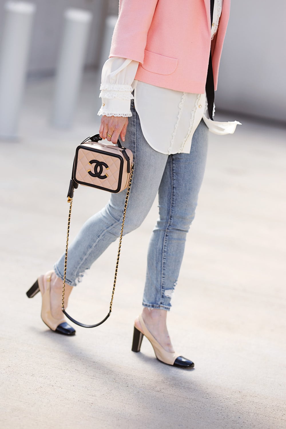 style of sam in cropped pink jacket and chanel vanity bag with cap toe heels