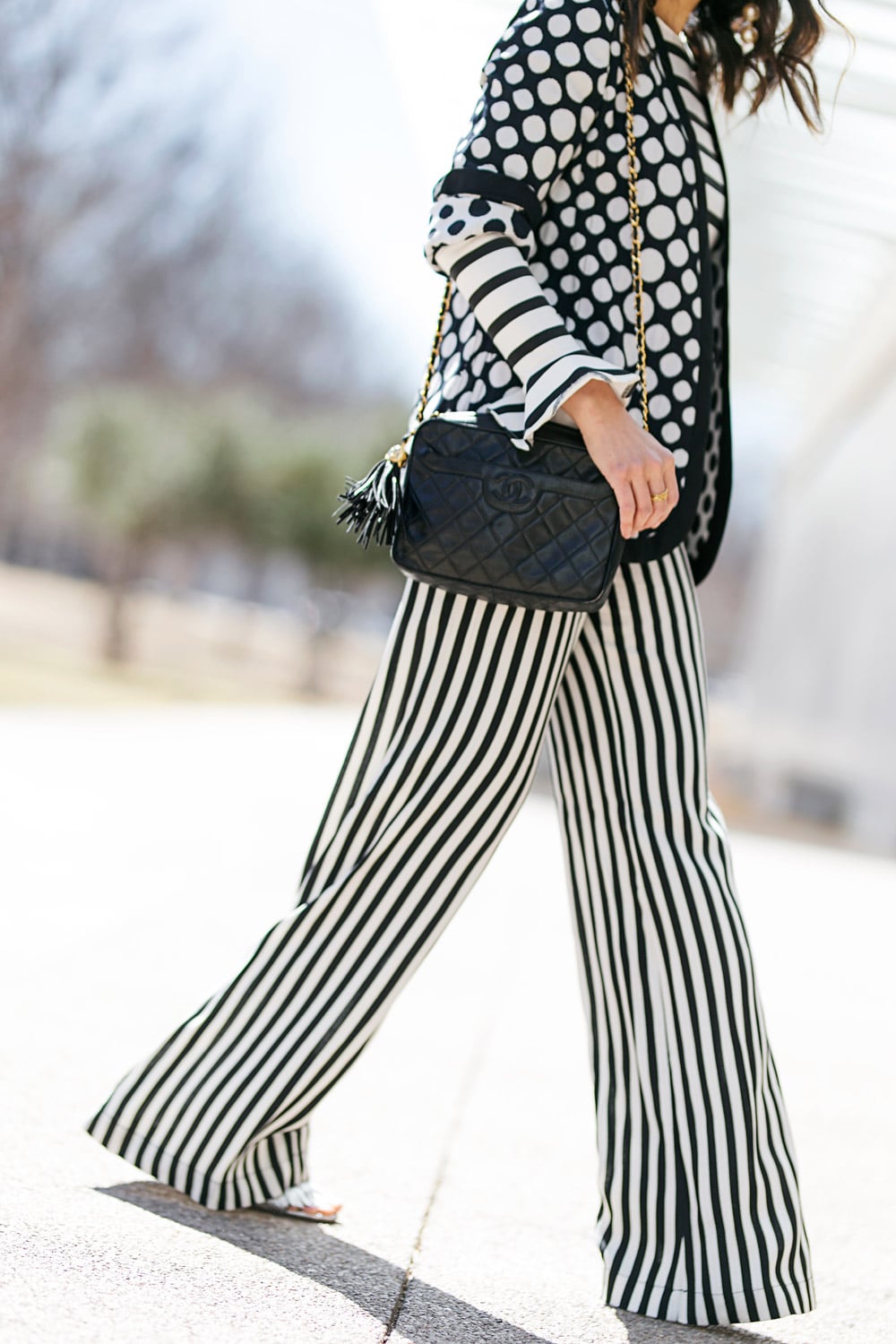 style of sam in polka dot jacket and reformation striped pants