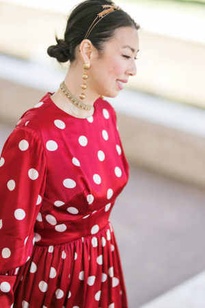 style of sam in vintage chanel ball drop earrings and red polka dot dress