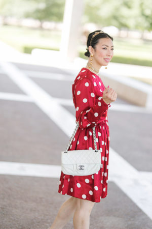 style of sam in red polka dot dress and white chanel flap bag