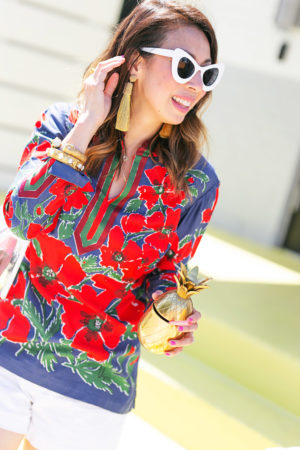 style of sam in red floral tunic gold tassel earrings pineapple tumbler