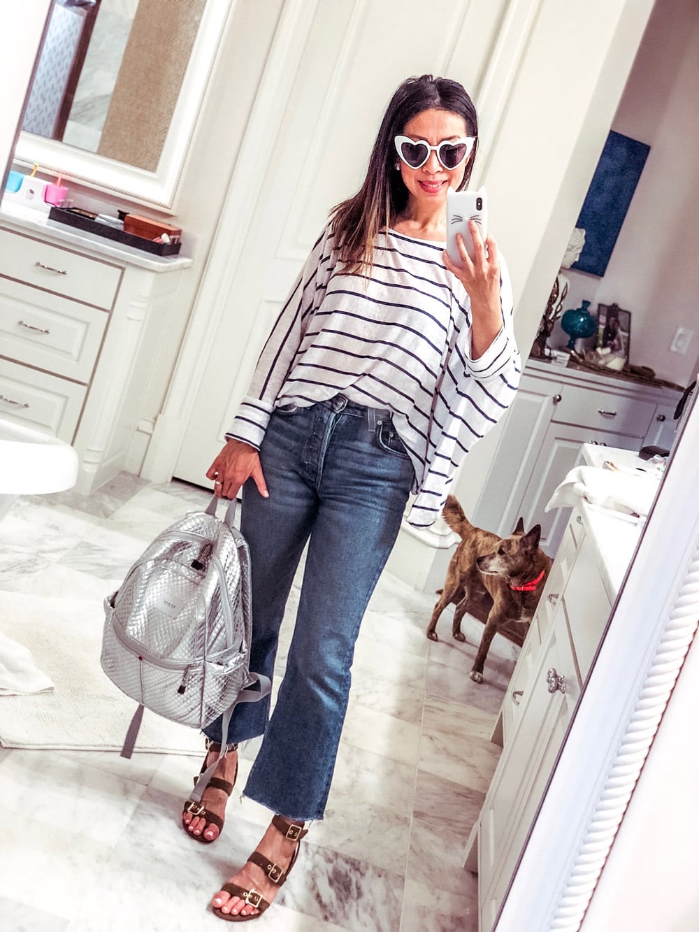 style of sam in ruti striped oversized linen tee reformation crop flare jeans vionic carmel sandals heart sunglasses