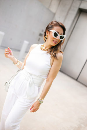 style of sam in white jumpsuit chanel turnlock necklace earrings cat eye sunglasses