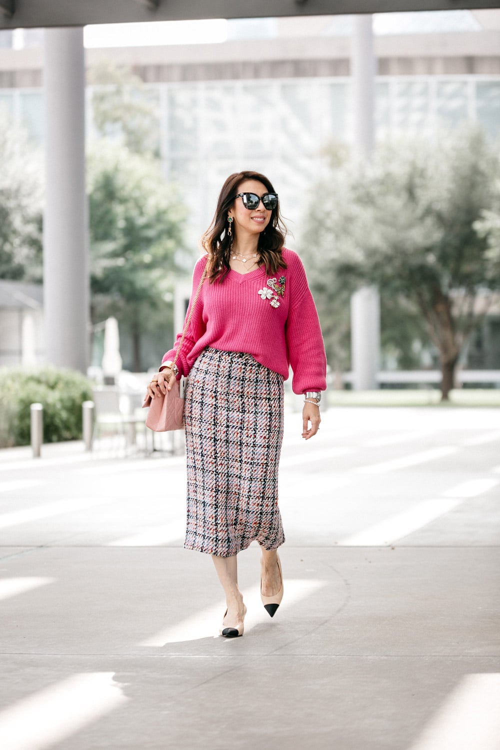 style of sam in pink v-neck sweater tweed skirt chanel cap toe heels pink reissue