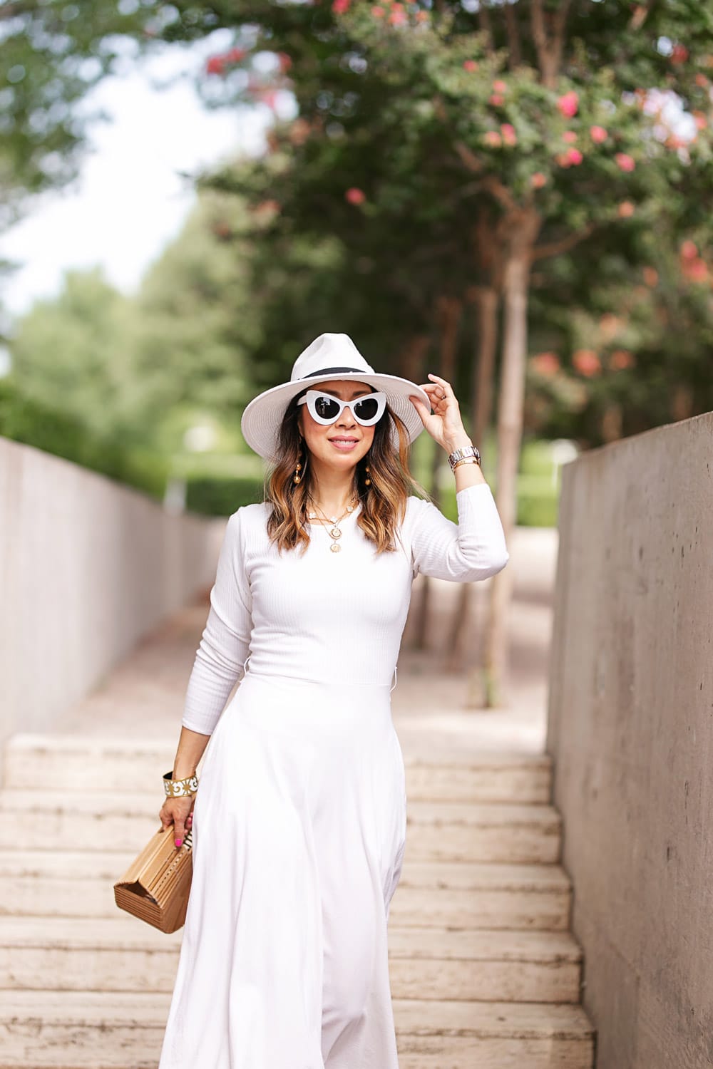 style of sam in white midi dress fedora hat cat eye sunglasses