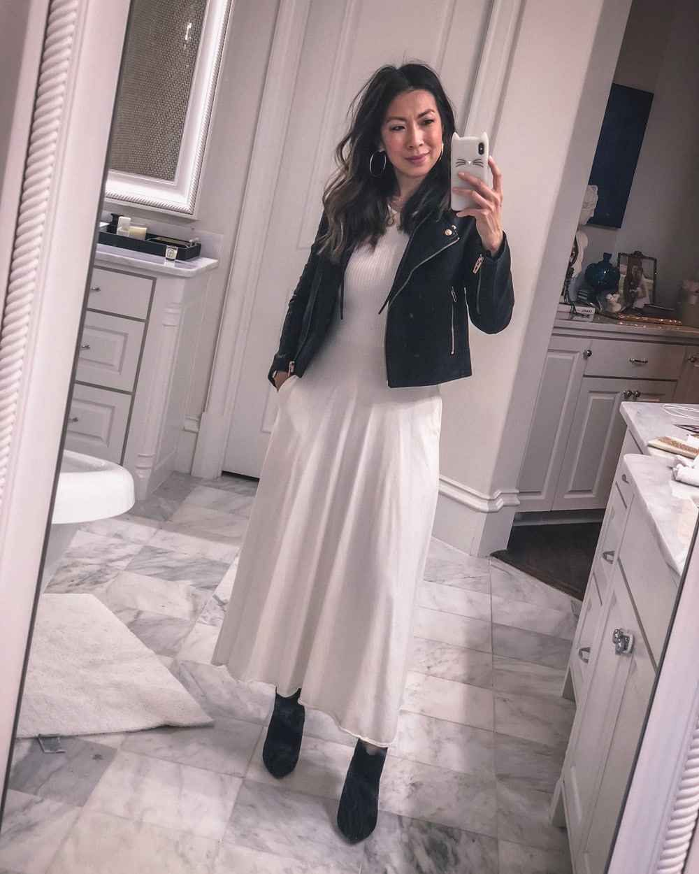 style of sam in white midi dress black leather jacket with hoodie booties