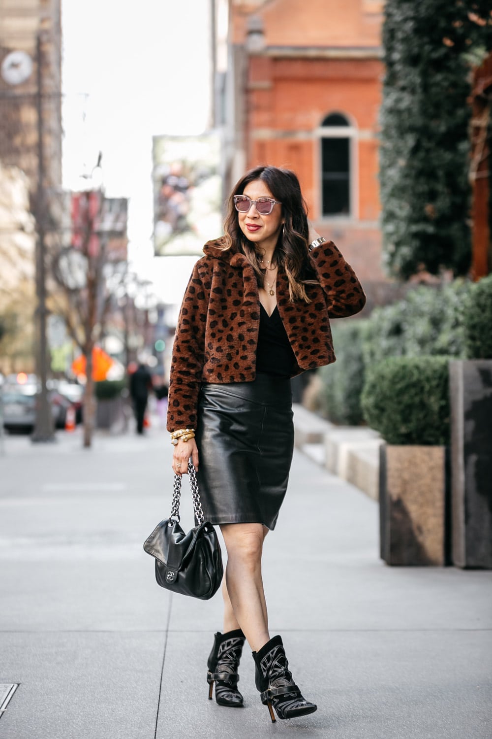 style of sam in leopard faux fur leopard teddy jacket leather skirt chanel soft and chain flap isabel marant blackson boot