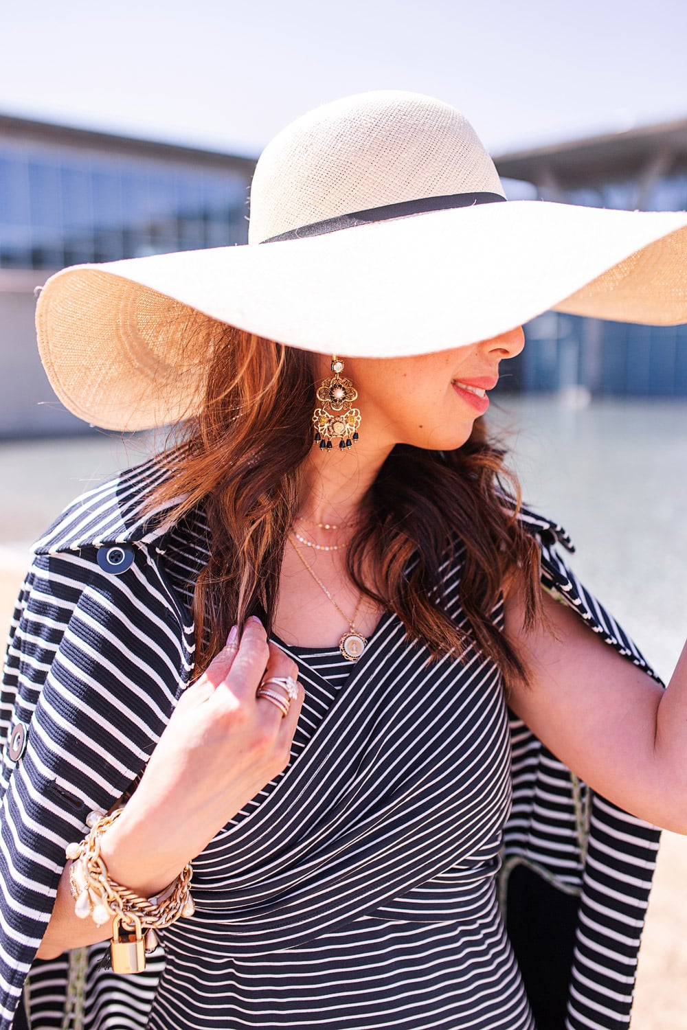 style of sam in cabi navy and white striped launch dress, cha cha chandelier earrings, wide brim hat