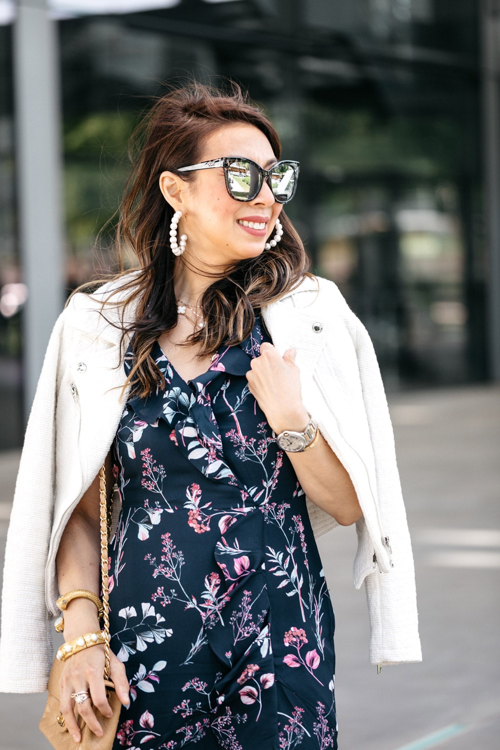 style of sam in lele sadoughi pearl hoop earrings and white tweed moto jacket over floral maxi dress
