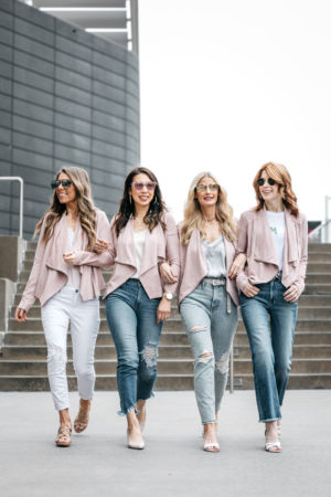 chic at every age in blush pink draped jacket and jeans, naturalizer heels