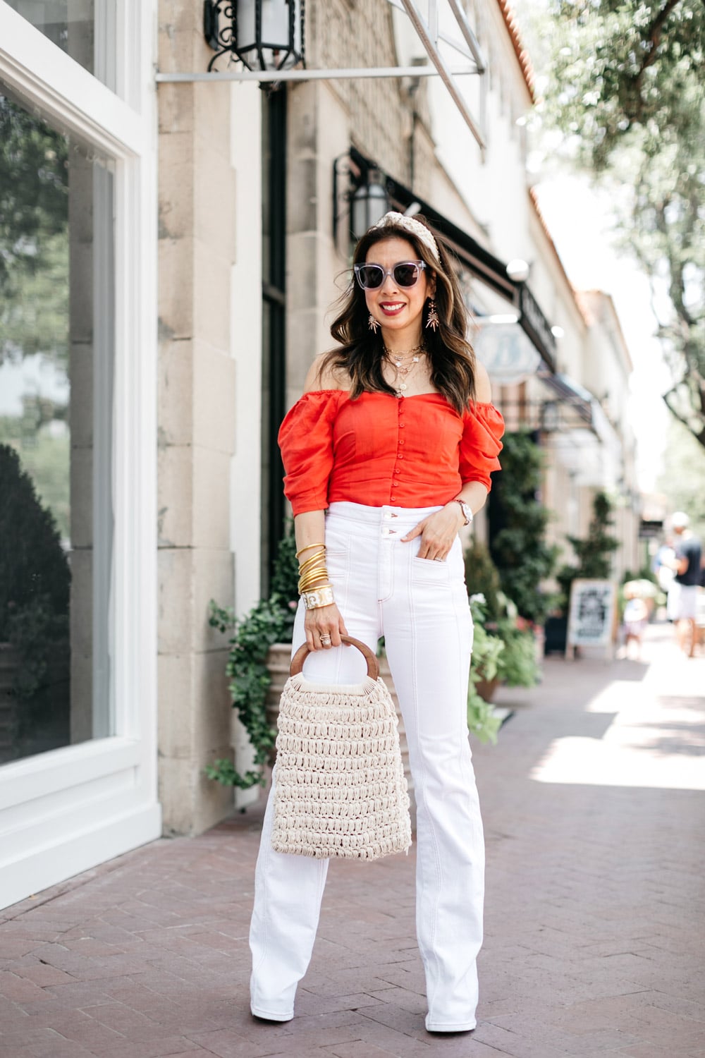 style of sam in red puff sleeve top, veronica beard white farrah jeans, lele sadoughi rhinestone headband, macrame bag, what to wear for 4th of july