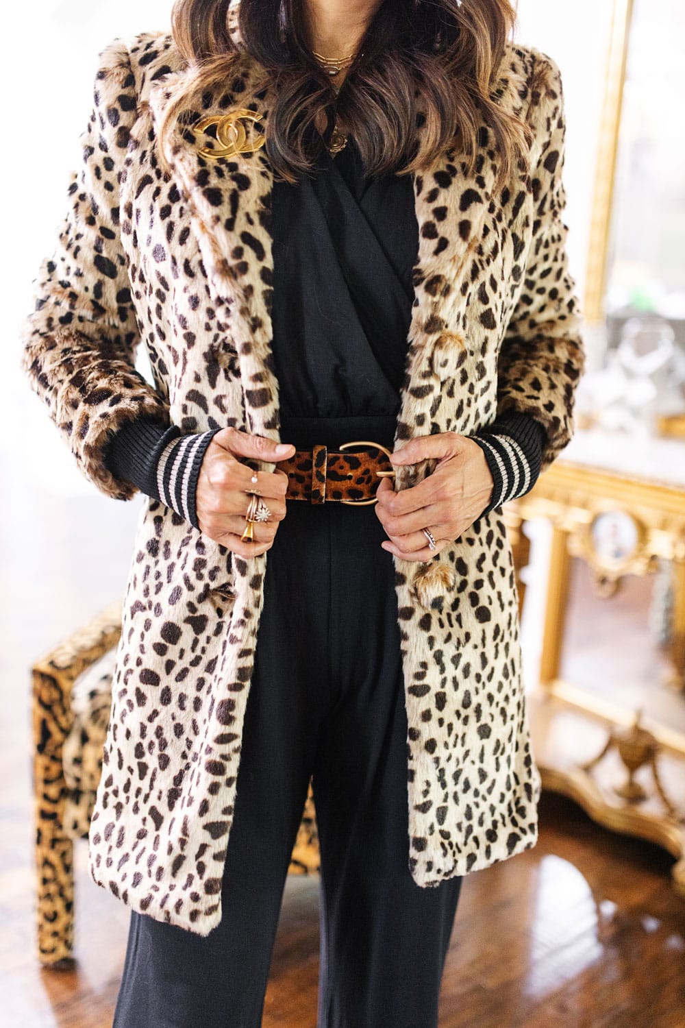 style of sam in cabi josephine leopard coat, downtown jumpsuit, beast belt