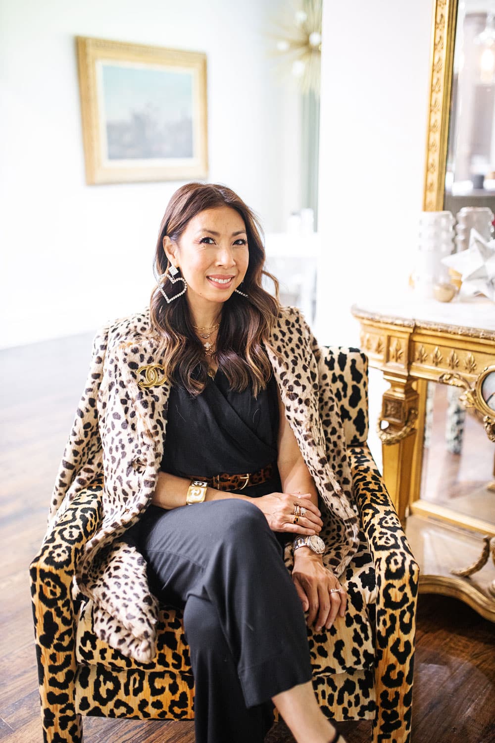 CABI Fall 2019 Animal Print Trend, style of sam in cabi josephine leopard coat, downtown jumpsuit, beast belt at home with leopard parson chairs