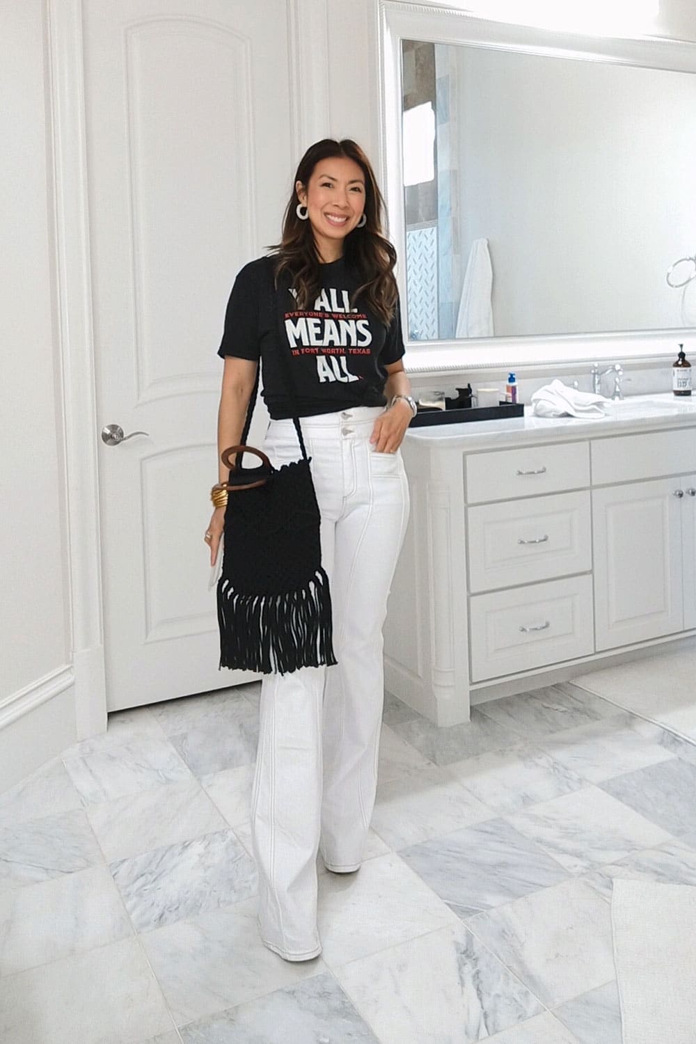 style of sam in y'all means all tee, veronica beard white farrah flare jeans, danielle nicole macrame bag from box of style