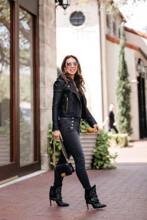 style of sam in black hooded moto jacket, high rise skinny jeans, isabel marant blackson bootie